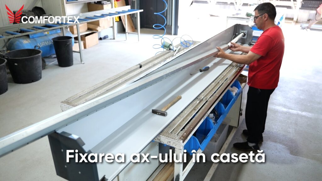 Fixarea ax-ului în caseta unei uși garaj